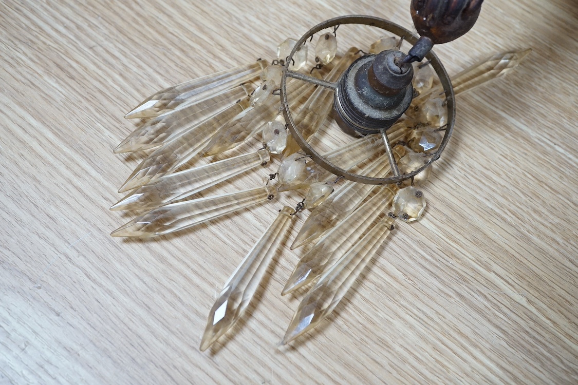 A pair of gilt twin branch cherub chandeliers with glass drops. Condition - some losses